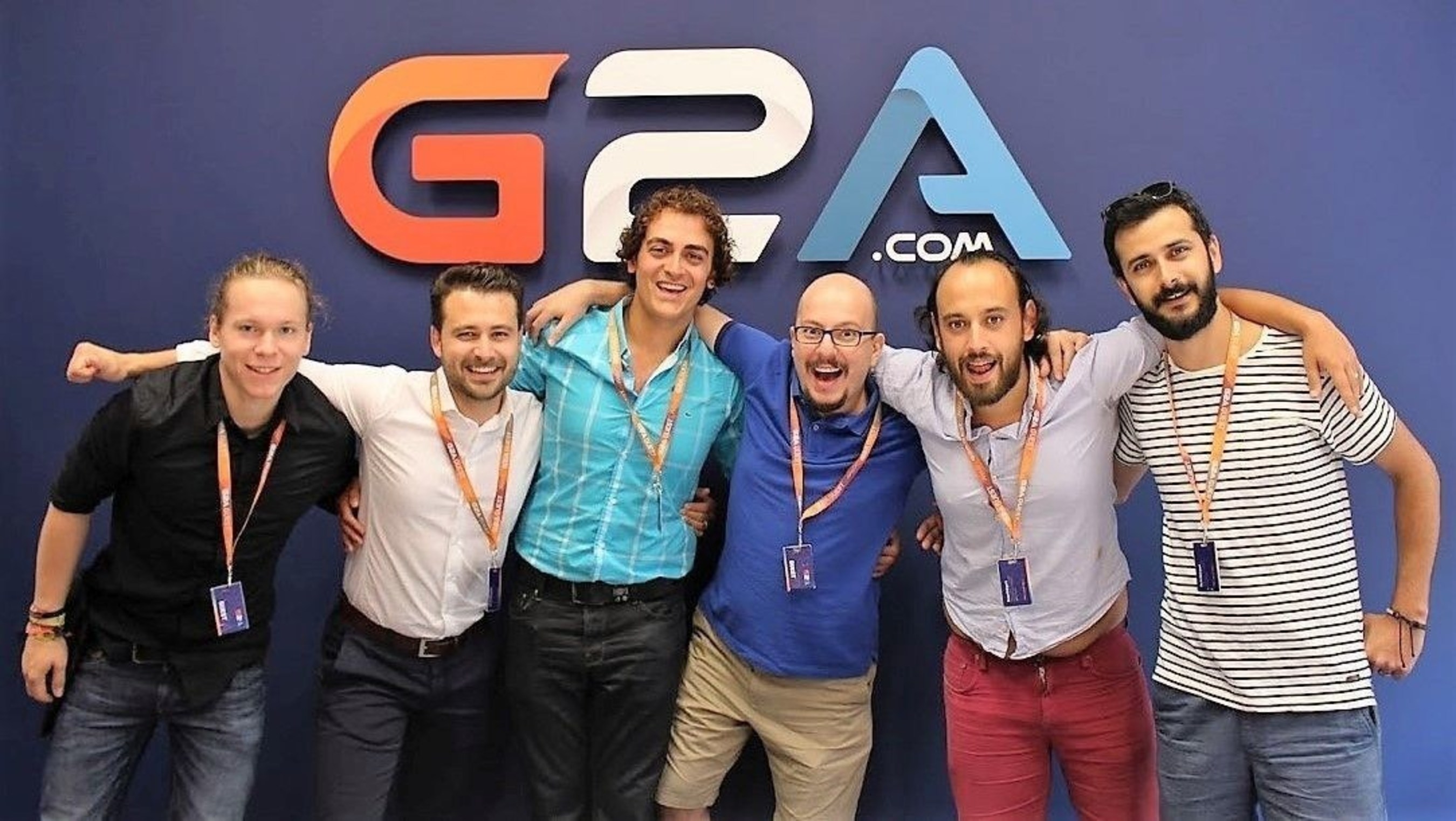 Some of the Journalists pose in the G2A meeting room (PRNewsFoto/G2A.COM)
