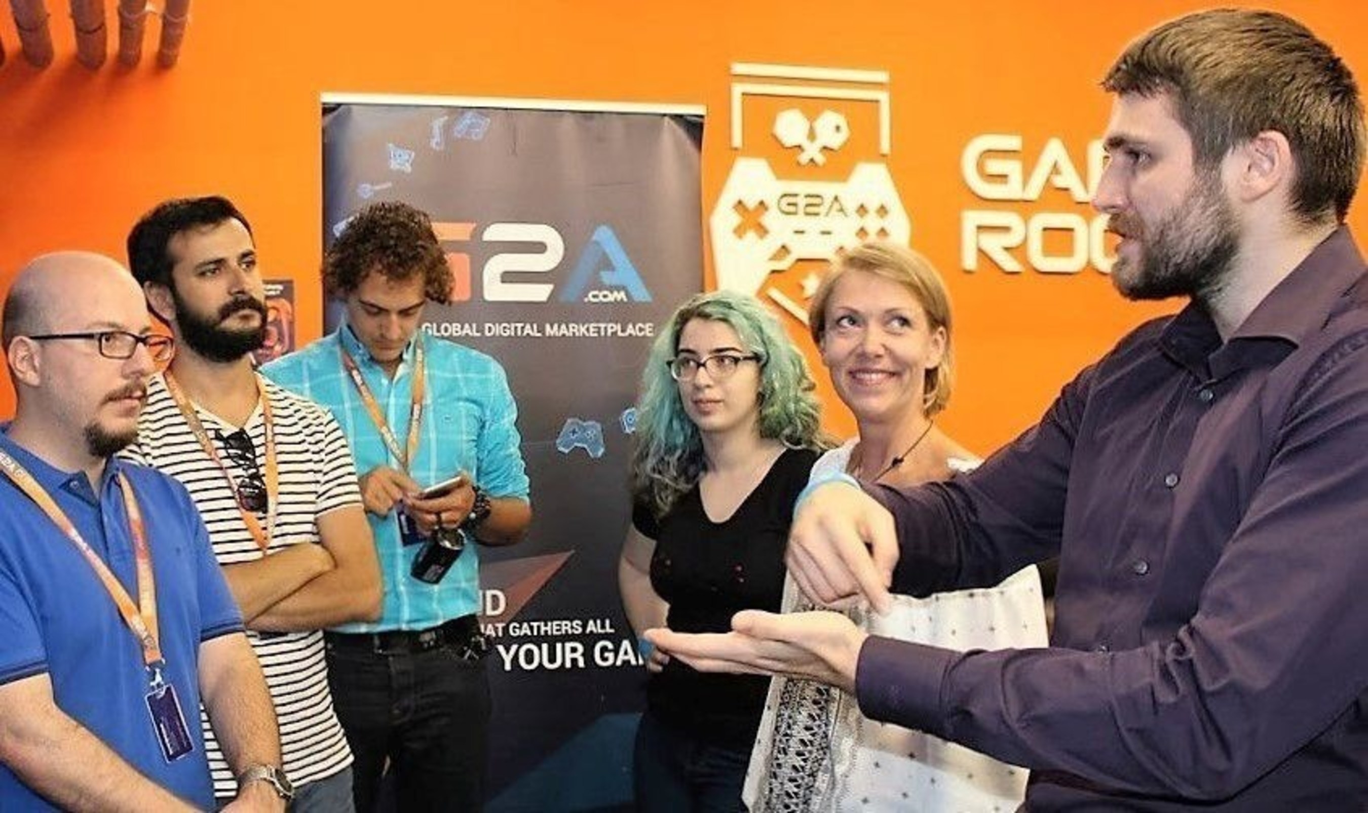 G2A's CMO and co-founder, Dawid Rozek, talking to journalists in the G2A gamesroom, responding to their questions about 'the early days of G2A'. (PRNewsFoto/G2A.COM)