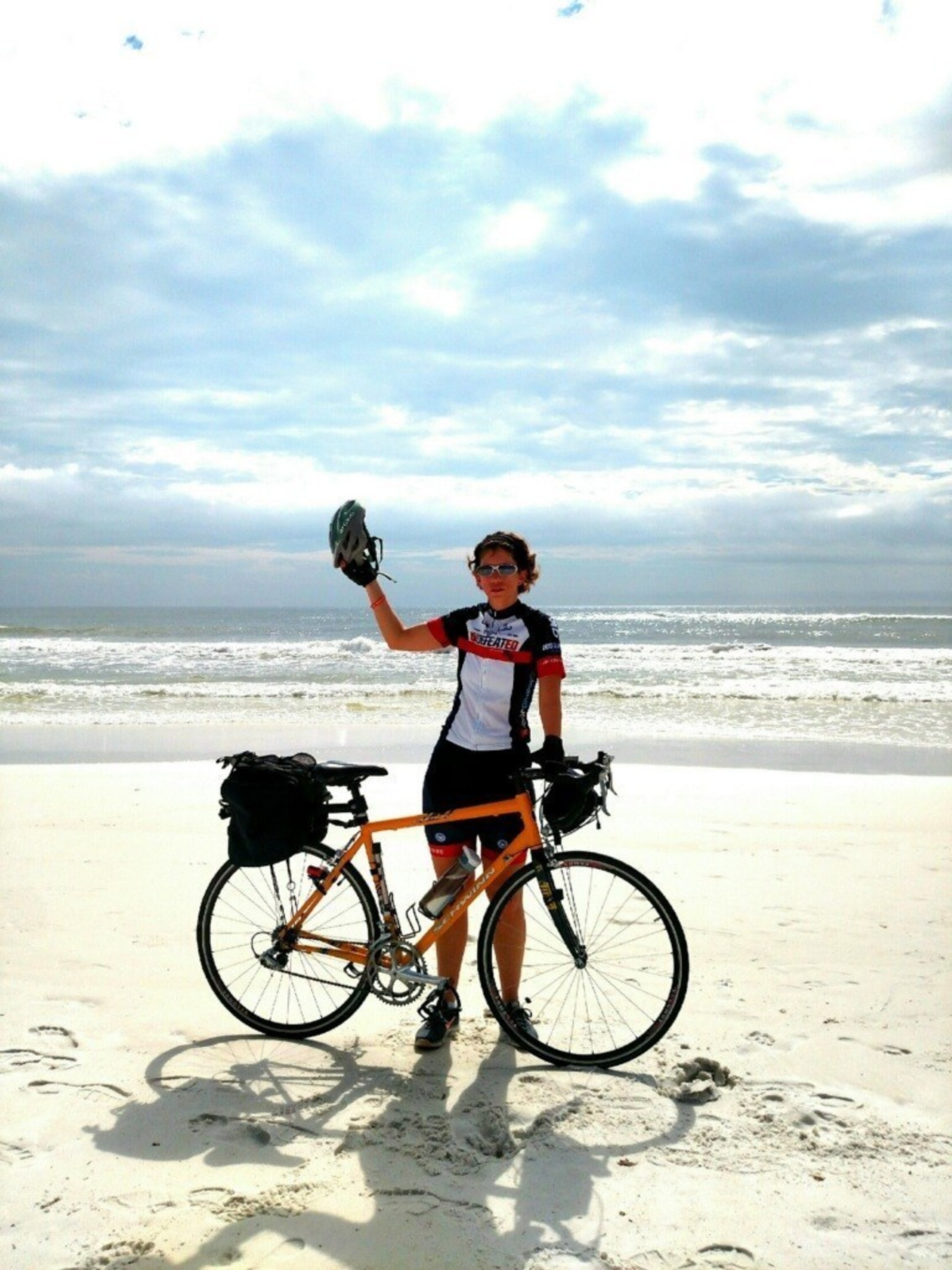 Patricia Waiwood and her bike at the end of her cross-country ride to Eglin AFB in Florida