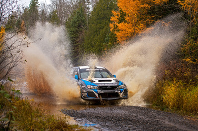 David Higgins charges his WRX STI through deep water at Lake Superior Performance Rally 2014.
