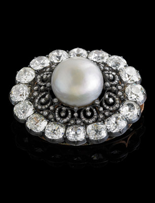 The largest near-round natural saltwater pearl discovered to date will auction at Rago (www.ragoarts.com) on December 7. It is the central element of the "Putilov Pearl Brooch", carried by a Russian industrialist to Paris in 1918. The pearl is 8% larger than the prior record holder, which sold for $1,368,075 in May 2014 at Woolley and Wallis auctions in England. Accompanied by a GIA Pearl Identification Report. The 19th c. brooch, 2" x 1 5/8", is formed of 16 old mine cut diamonds (28ct tw) and rose cut diamonds set in silver topped gold. Unrecognized marks. Bidding opens at $100,000. (PRNewsFoto/Rago Auctions)