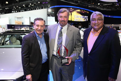 Ricardo Rodriguez-Long (left) and Jaime Florez (right) present the Hispanic Motor Press Award 