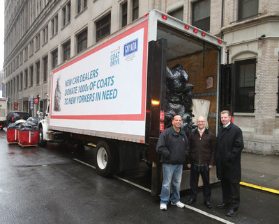 Driving Up Winter Coat Donations: New car dealers deliver over 3,000 coats to support New York Cares 2014 Winter Coat Drive. (L to r) Brian Miller, owner of Manhattan Motorcars; New York Cares executive director Gary Bagley and Bob Vail, chairman of the Greater New York Automobile Dealers Association with a truck full of coats at New York Cares distribution center at West 31st in Manhattan.