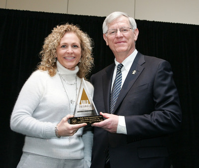 Tina Fehr, AmLactin® Senior Product Manager, Accepts the American Academy of Dermatology’s 2011 Gold Triangle Award from Academy President, William D. James