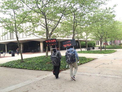Students Riled by Rutgers Observer Censorship of Article About Dr. Richard Kaul Take to the Sidewalks Wearing Electronic Signs