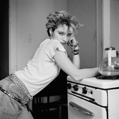 According to Richard Corman: This is the first photo I took of Madonna in her Lower Eastside apartment. She just got up and leaned on that stove, and I took the shot. There's nobody that can lean on a stove like that.