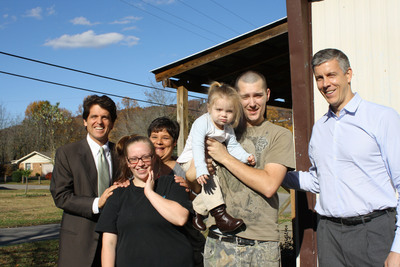 Secretary of Education Arne Duncan (right), joins Save the Children-s Senior Vice President Mark Shriver to visit a Whitley County family in Save the Children-s Early Steps to School Success program. Also pictured, Save the Children home visitor Martha Paul who works with the family: Holly and Chris and their daughter Lelia, 20 months old.