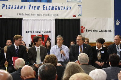 Secretary of Education Arne Duncan (with mic) at an early learning town hall at Pleasant View Elementary School In Williamsburg, KY. He is flanked by Save the Children Senior Vice President Mark Shriver (left) and Senator Robert Stivers (R-25), President of the Kentucky State Senate (right).