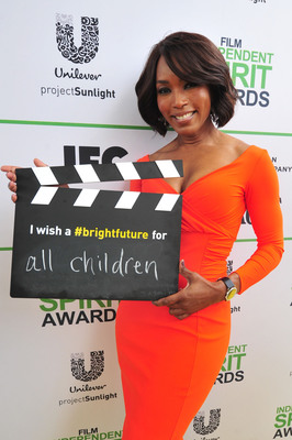 SANTA MONICA, CA - MARCH 01: Angela Bassett calls ACTION! to create a brighter future for all children on the Yellow Carpet presented by Unilever Project Sunlight during the 2014 Film Independent Spirit Awards at Santa Monica Beach on March 1, 2014 in Santa Monica, California. (Photo by Mark Sullivan/WireImage)