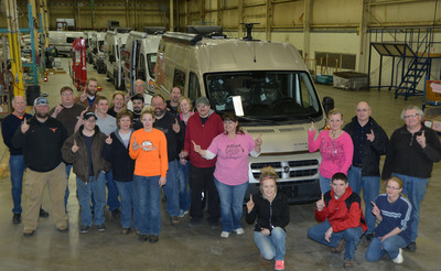 Winnebago employees celebrate the first Travato to be completed in the new Lake Mills Assembly Facility.