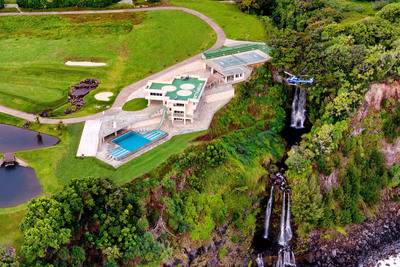 Set on a breathtaking cliff along the Hamakua Coast, this former macadamia nut plantation has been transformed into a jaw-dropping, 9.44-acre estate with five bedrooms, ten bathrooms, unparalleled amenities and never-ending views of the Pacific. The property includes a helipad, 9-tee golf course, paved running track, Olympic infinity pool, and 450-seat tennis stadium and basketball court.
