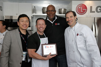 Trey Shearer of Silver Creek Elementary School accepts the award for winning the LG Coaches Cook-Off from William Cho, president and CEO of LG Electronics USA, left, basketball legend Clyde Drexler, back, and Baylor University Head Basketball Coach Scott Drew, right.