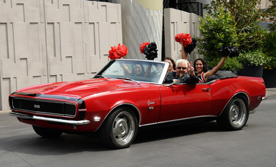Guy Fieri arrives in his classic Camaro with UNLV cheerleaders at The Quad Resort & Casino on Fri., April 4, 2014. Fieri-s restaurant, Guy Fieri-s Vegas Kitchen & Bar, is set to open April 17.