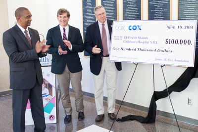 Cox Communications' Kevin Monroe presents a $100,000 grant on behalf of the James M. Cox Foundation to support UF Health's Neonatal Intensive Care Unit. Scott A Rivkees, M.D. and David Burchfield, M.D. accepted the grant on behalf of UF Health Shands Children's Hospital.