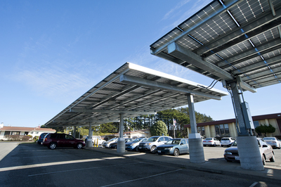 The solar and energy efficiency project includes solar electric generation facilities at 16 district sites, including the district office, shown here. 