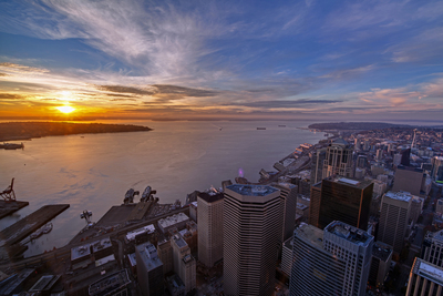 Photographer Mike Reid captures sunset in Seattle over Elliott Bay from Columbia Center's Sky View Observatory