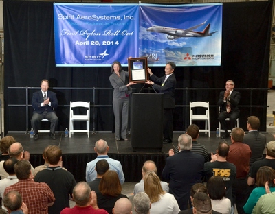 Vice President of Supply Chain for Mitsubishi Aircraft, Fujimori-san, presents a plaque to Spirit AeroSystems Director of Business & Regional Jet programs, Cathy McClain at a celebration marking the delivery of the first test flight pylon for the Mitsubishi Regional Jet.