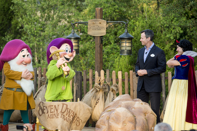 SEVEN DWARFS MINE TRAIN COASTER DEDICATED AT WALT DISNEY WORLD (May 2, 2014):  Tom Staggs, chairman of Walt Disney Parks & Resorts, joins Disney characters Sleepy Dwarf, Dopey and Snow White May 2, 2014 in the Magic Kingdom park at Walt Disney World Resort in Lake Buena Vista, Fla., to dedicate the park's newest attraction, the Seven Dwarfs Mine Train.  The attraction, which will open to guests May 28, is a family-style coaster that immerses guests in playful and musical scenes inspired by the Disney...