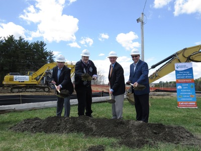 From left to right: Mike Minkos, president, Summit Natural Gas of Maine; Steve Woods, chairman, Yarmouth Town Council; Nathan Poore, town manager, Falmouth; and Bill Shane, town manager, Cumberland all dig in the dirt at the groundbreaking ceremony at the Cumberland Fairgrounds.
