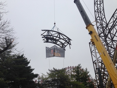 Six Flags Great America tops off world's tallest, steepest and fastest wooden roller coaster, Goliath.