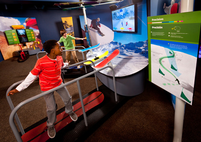 Visitors learn that math is all around them as they ride a snowboard simulator at Raytheon's MathAlive! interactive museum exhibit, coming to the Museum of Science, Boston.