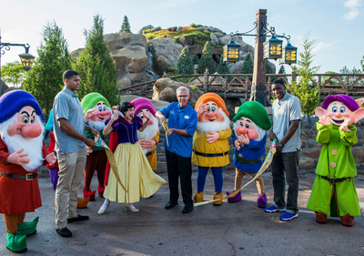 Seven Dwarfs Mine Train Officially Opens at Walt Disney World Resort: Snow White and the Seven Dwarfs join Phil Holmes (center), vice president of Magic Kingdom Park, and Orlando Magic players Tobias Harris (left) and Victor Oladipo (right) May 28, 2014 to officially open Seven Dwarfs Mine Train to Walt Disney World Resort guests. Representatives of Big Brothers Big Sisters of Central Florida were also in attendance to commemorate the occasion. The attraction completes New Fantasyland, the largest expansion in Magic Kingdom history. Magic Kingdom is located at Walt Disney World Resort in Lake Buena Vista, Fla. (Ryan Wendler, photographer)