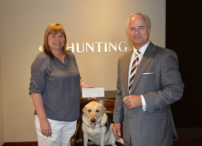 Hunting PLC Donates $135,000 To Patriot PAWS Service Dogs