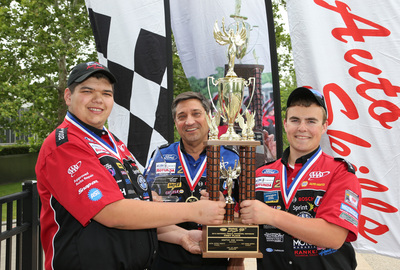 Colt Morris, Instructor Carl Hader and Justin Bublitz from Grafton High School in Grafton, Wis. celebrate after winning the National Championship at the 65th Annual Ford/AAA Student Auto Skills Competition on June 10, 2014 at Ford World Headquarters in Dearborn, Mich.