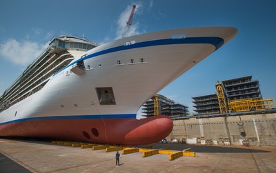 A shipyard worker is seen next to the hull of the new 930-passenger cruise ship, Viking Star. The ship was "floated out" on Monday, June 23, in a traditional ceremony that took place at Fincantieri’s Marghera shipyard outside Venice, Italy. Debuting in spring 2015, Viking Star is the first of three new ships from Viking Ocean Cruises (www.vikingoceancruises.com), with maiden voyages in Scandinavia and the Baltic; and the Western and Eastern Mediterranean.