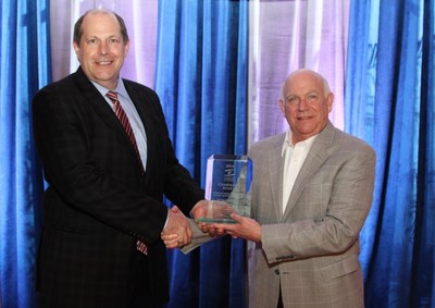 Southern Company’s Chief Environmental Officer Dr. Larry S. Monroe (L) accepts Chairman’s Award from Southeastern Electric Exchange Executive Director Jim Collins.
