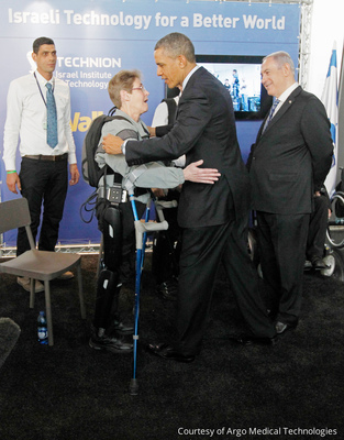 President Obama Hugs Retired Sergeant Terry Hannigan at an Israeli Event where the ReWalk was Demonstrated. ReWalk Robotics Received the First Ever FDA Clearance for a Personal Exoskeleton System in the United States on June 26, 2014.