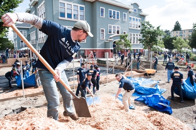 Volunteers from Delta and the community work together to build a playground in just one day for the children of the University Heights Center in Seattle.