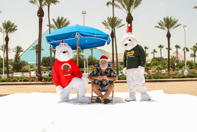 It's Christmas in July: Santa enjoys snow, sunshine and a drink as Ice Land Ice Sculptures attraction is announced to open Nov. 15 at Moody Gardens, Galveston Island