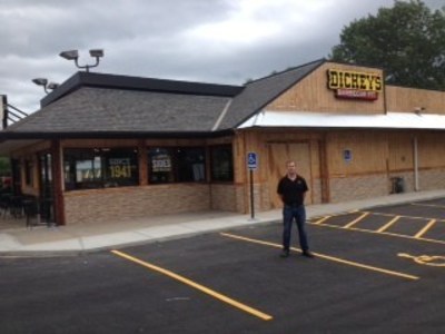 Ryan Wenrich outside his new Dickey's Barbecue Pit in Liberty. Grand opening includes big barbecue giveaways.