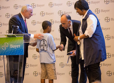 A NYC summer camper is greeted by New York City Police Commissioner William J. Bratton, Bayer Corporation President Phil Blake and Dr. Mae Jemison, NASA Astronaut, on July 9, 2014, at Grand Central Terminal in New York City. Students from the Police Athletic League (PAL) of New York City spent time at Grand Central Station as part of Bayers Science For A Better Life exhibit.