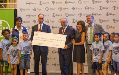 New York City Police Commissioner William J. Bratton accepts a $50,000 grant from Bayer Corporation President Phil Blake on July 9, 2014, at Grand Central Terminal in New York City. The grant will support STEM (science, technology, engineering and mathematics) education programs at the Police Athletic League of New York City centers throughout NYC.