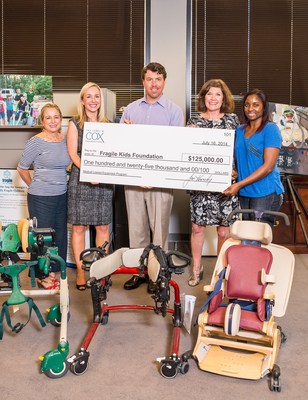 Cox Enterprises Executive Vice President Alex Taylor Presents a $125,000 Grant to Fragile Kids Foundation on behalf of the James M. Cox Foundation. The grant will allow Fragile Kids Foundation to purchase 70 additional pieces of therapeutic and rehabilitative equipment. (DIN Photography)