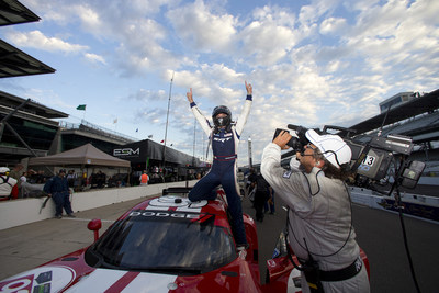 Driver Jonathan Bomarito celebrates winning first place in the GTLM class in the IMSA TUDOR United SportsCar Championship Brickyard Grand Prix on Friday, July 25, 2014. Bomarito and co-driver Kuno Wittmer piloted the No. 93 Dodge Viper SRT GTS-R race car.