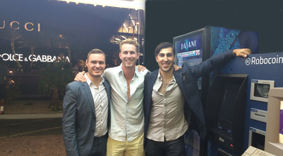 Coin Cloud CEO Chris McAlary (right) and Chief Compliance Officer Josh Schlacter (left) with Robocoin CEO Jordan Kelley (center) stand next to first Bitcoin ATM on the Las Vegas Strip