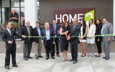 Grand Opening of the Home2 Suites by Hilton Long Island City ribbon cutting ceremony.  Pictured from left:  John Parker, (RHG), Ken Fisher (Cozen O'Connor), Peter Rudewicz (Hilton Worldwide), Martin Markowitz (NYC & Co), Yoni Bokser (Economic Development Officer from Queens Borough Presidents office), and owners Sandy, Jacob, Melissa, Jessica, Benika and Daniel Rad (RadSon Development)