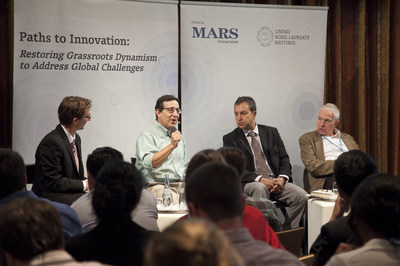 Mars, Incorporated Vice President of Corporate Innovation Ralph Jerome (second from left), speaks about challenges faced by the food and agriculture industry to feed a growing population at the 5th Lindau Meeting on Economic Sciences in Lindau, Germany on Aug. 21, 2014. The Mars-sponsored event brought 120 Lindau young economists together to discuss how to overturn blocks to implementing innovation. Also pictured, from left, are Francois Koulischer, Lindau Young Economist; University Libre de Bruxelles...