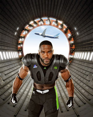 Pictured here, Russell Athletic brand ambassador and pro football wide receiver Pierre Garcon wears the CarbonTek shoulder pad system, with an exosketon made of 787 carbon fiber. He is shown inside a Boeing 787 Dreamliner carbon composite fuselage.