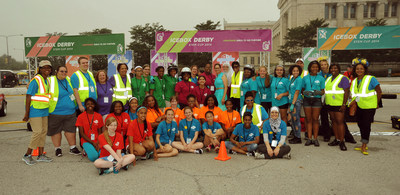The thirty young women who participated in the first annual Icebox Derby, hosted by ComEd, the largest electric utility in Illinois, pose for a group shot with their mentors before the action starts at the Icebox Derby Race Day event.