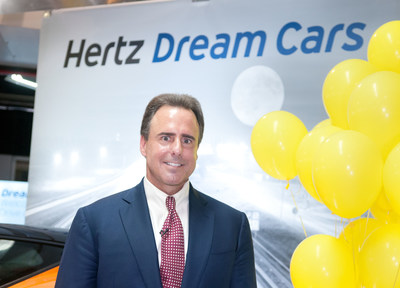 Mark Frissora, Hertz Chairman & CEO celebrates the 25,000th Dream Cars rental on Wednesday, Sept. 3, 2014 in Miami. (Mitchell Zachs/AP Images for Hertz)