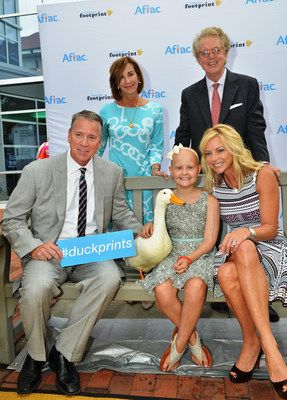 Hall of Fame pitcher Tom Glavine and his wife Chris were honored by Aflac today with the 2014 Duckprints Award for their contributions to the fight against childhood cancer. Joining them were 11 year-old Aflac Cancer Center patient Esme Miller, the Aflac Duck, and Aflac CEO Dan Amos and Aflac Foundation President Kathelen Amos.