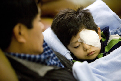 Reiniero, 3, rests after undergoing a successful surgery in his left eye during the FEH's 2011 visit to Trujillo, Peru. Learn more at Orbis.org.