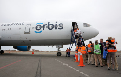 Flying Eye Hospital crew and planning staff greet one another upon landing in Trujillo, Peru for our 2014 training program. Learn more at Orbis.org.