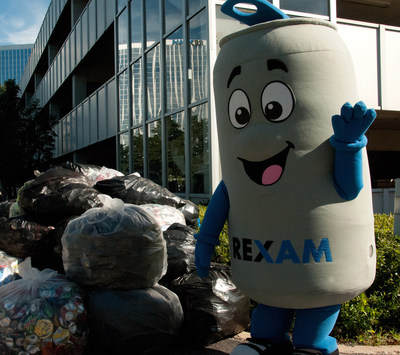The Rexam Can Man poses with bags of aluminum cans that were collected for recycling at the company's recent "Cans for Cash" event.