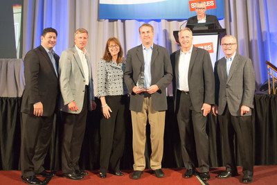 Staples senior executives present Product Innovation Award to Zonoff CEO, Mike Harris. Left to right: Demos Parneros, President, North American Stores & Online; Joe Doody, Vice Chairman; Shira Goodman, President, North American Commercial; Mike Harris - CEO, Zonoff; Mike Edwards, Executive Vice President, Merchandising; Ron Sargent, Chairman & Chief Executive Officer