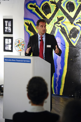 Mercedes-Benz Financial Services President and CEO Peter Zieringer speaks to guests about the partnership with Cranbrook Academy of Arts during the Experiencing Perspectives community art reception held at the company's regional headquarters in Farmington Hills on September 30.